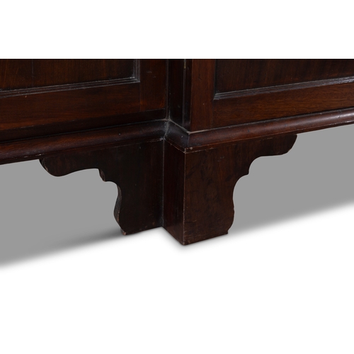 530 - A GEORGE III MAHOGANY FOUR DOOR BREAKFRONT BOOKCASE,  of architectural form with broken swan‑neck pe... 