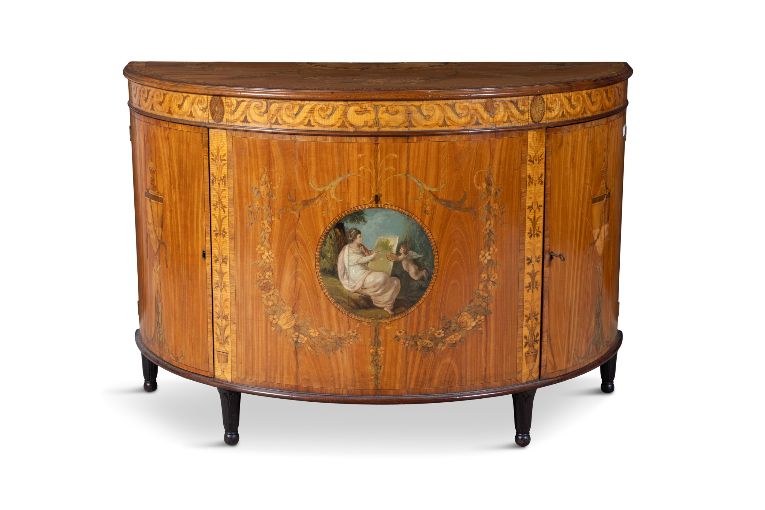 A GEORGE III SATINWOOD AND MARQUETRY DEMI- LUNE COMMODE, ATTRIBUTED TO ...