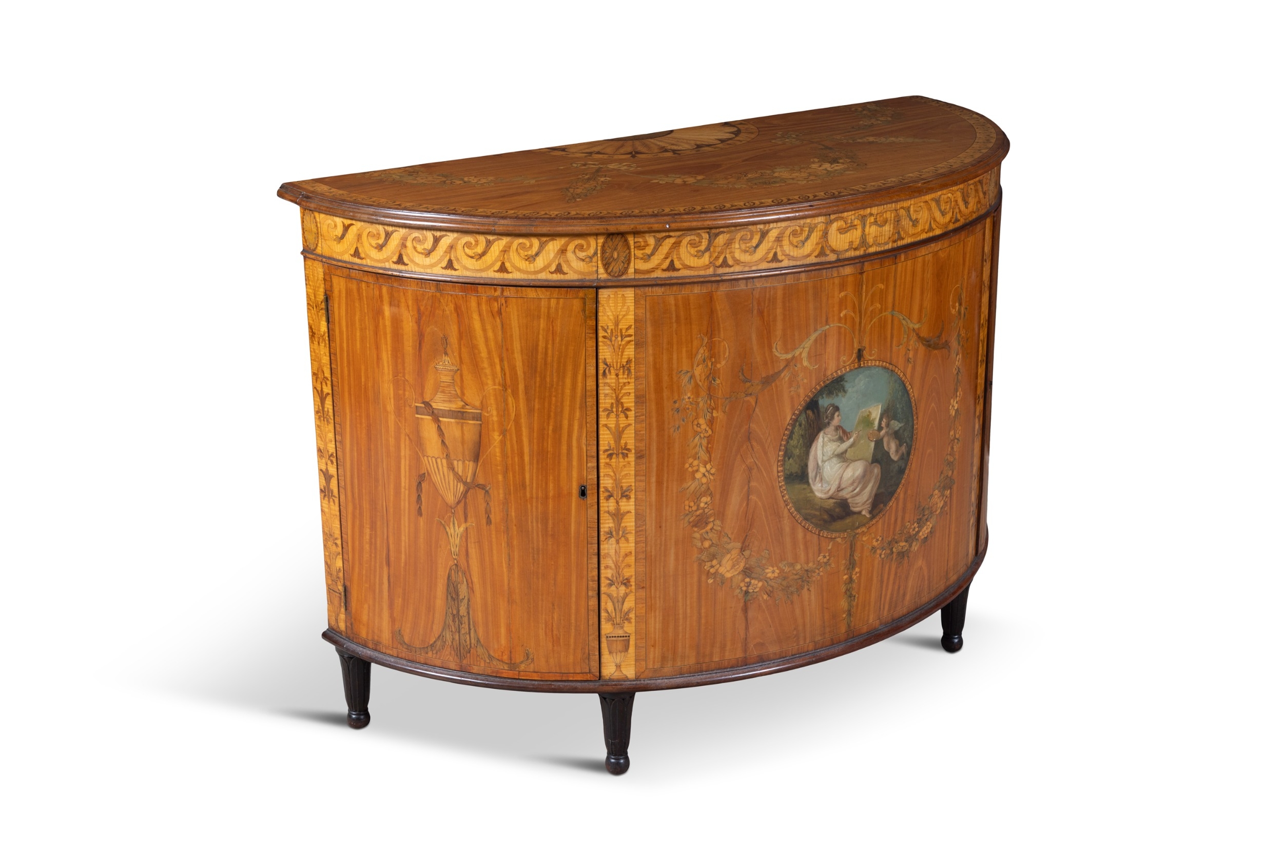 A GEORGE III SATINWOOD AND MARQUETRY DEMI- LUNE COMMODE, ATTRIBUTED TO ...