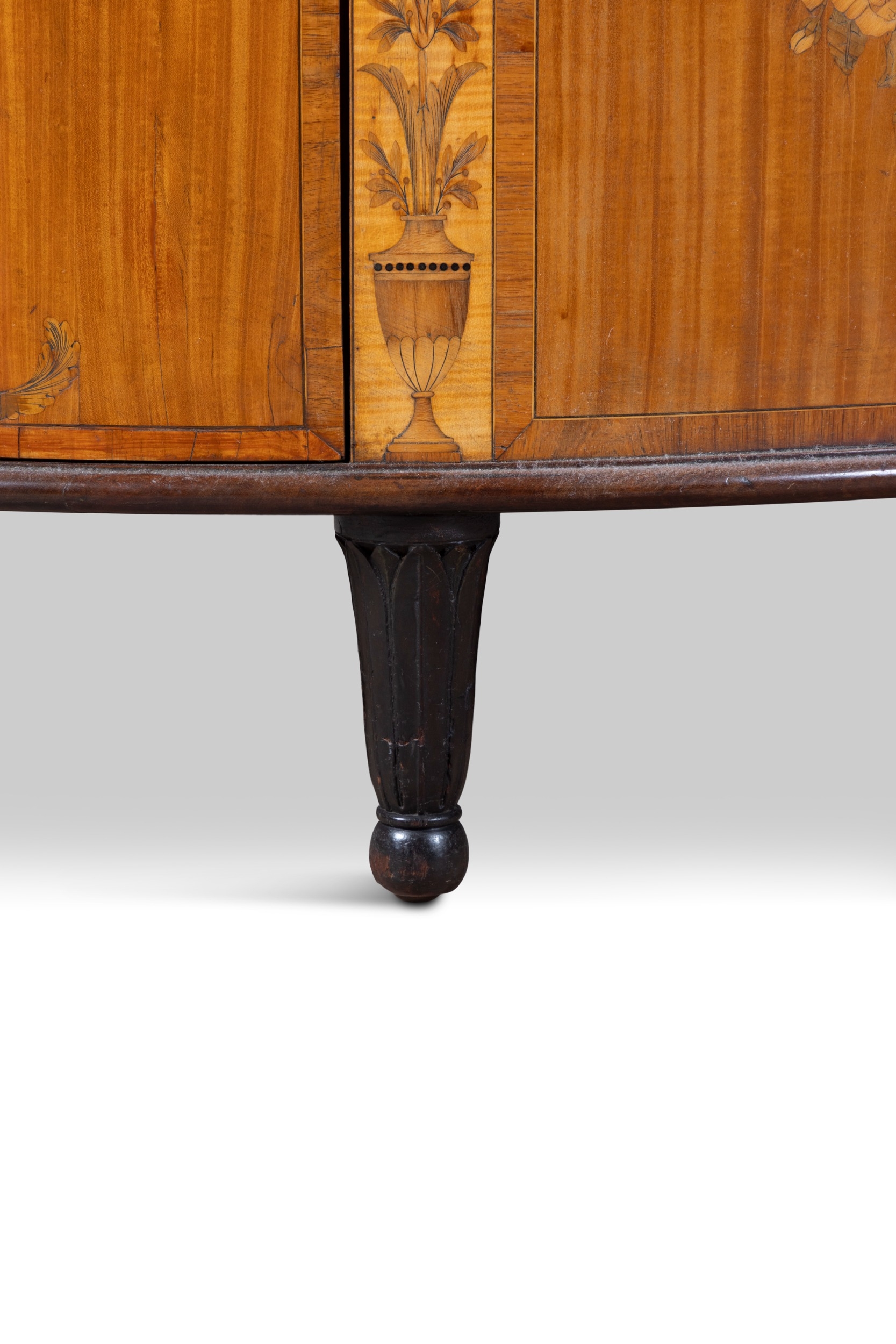A GEORGE III SATINWOOD AND MARQUETRY DEMI- LUNE COMMODE, ATTRIBUTED TO ...