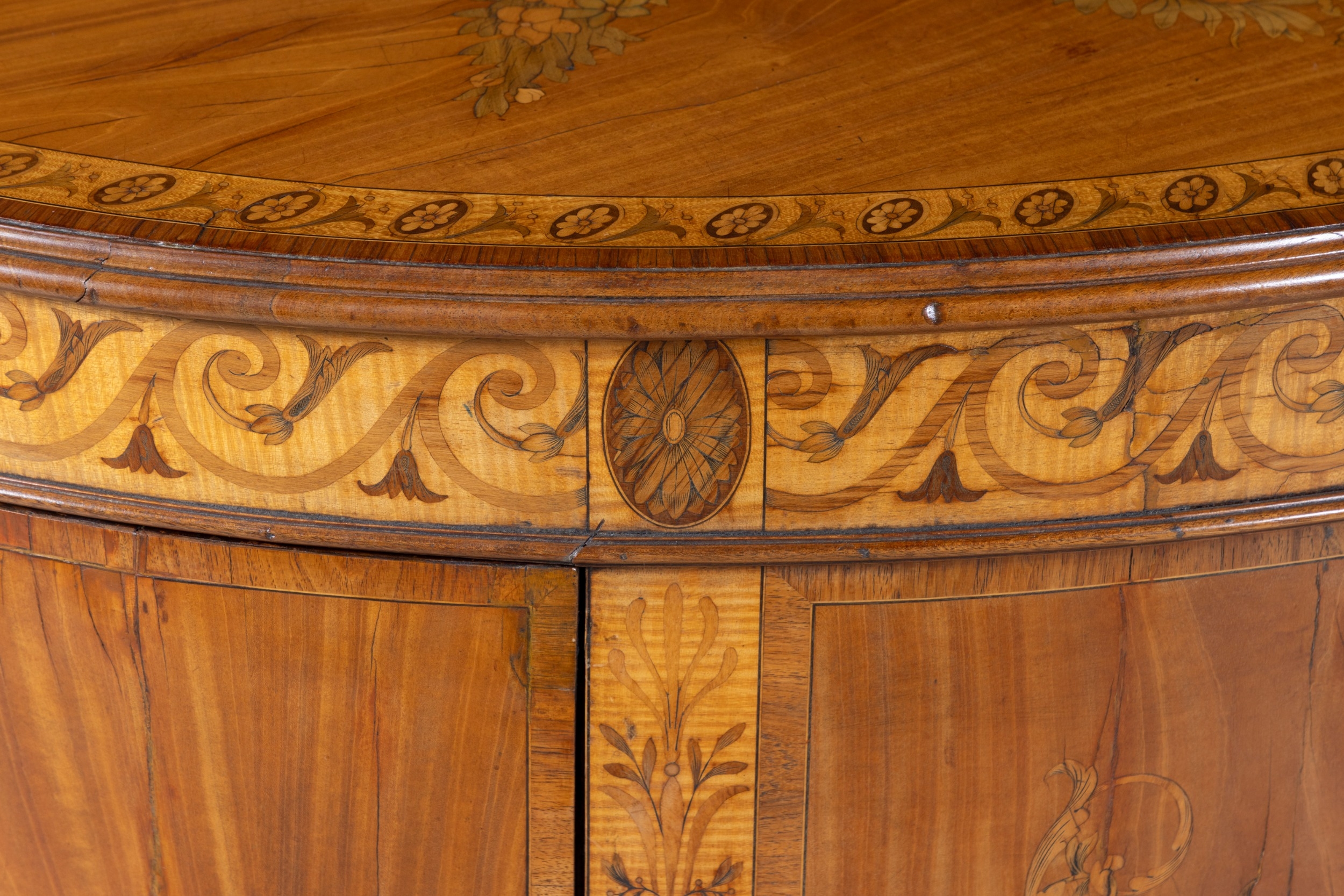 A GEORGE III SATINWOOD AND MARQUETRY DEMI- LUNE COMMODE, ATTRIBUTED TO ...