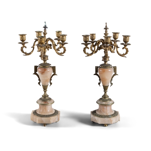 309 - A PAIR OF ALABASTER AND GILT METAL FIVE-LIGHT CANDELABRA, 19TH CENTURY, (E)   each with downswept ac... 