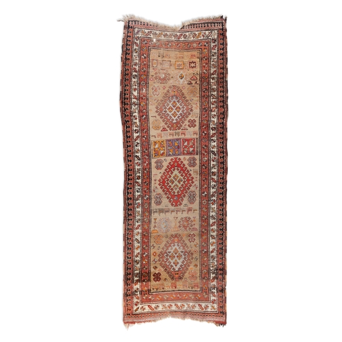 331 - AN ANTIQUE KURDISH WOOL RUNNER,    circa 1890, woven in brick red, terracotta and beige tones, the r... 