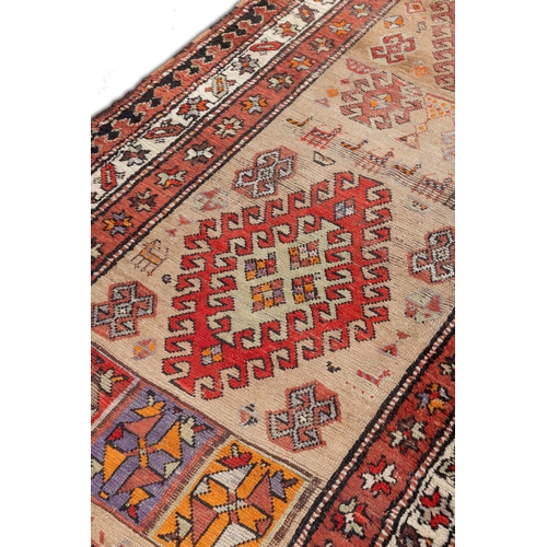 331 - AN ANTIQUE KURDISH WOOL RUNNER,    circa 1890, woven in brick red, terracotta and beige tones, the r... 
