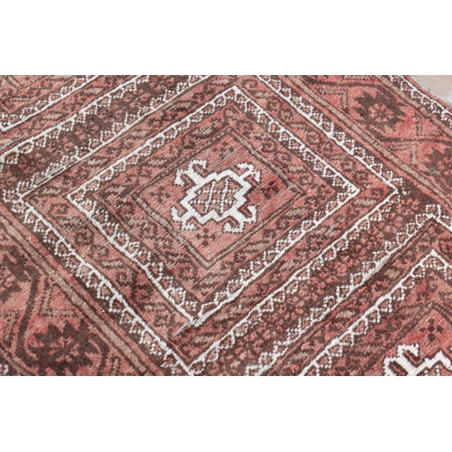 340 - A SEMI-ANTIQUE RED GROUND PERSIAN PRAYER RUG, 124 X 73CM   with three central guls within stylised f... 