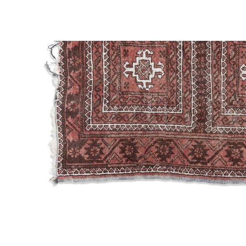 340 - A SEMI-ANTIQUE RED GROUND PERSIAN PRAYER RUG, 124 X 73CM   with three central guls within stylised f... 