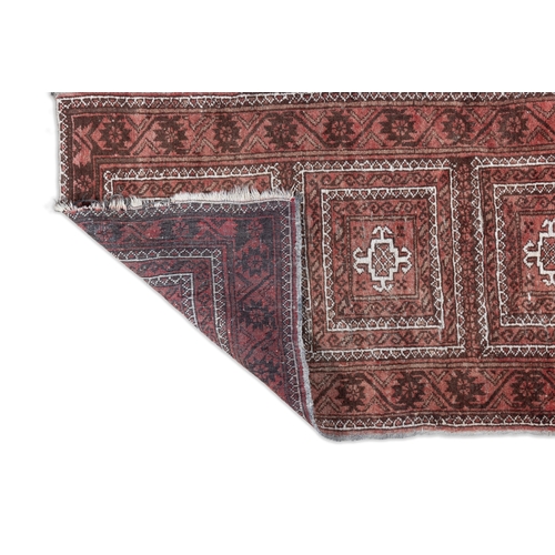 340 - A SEMI-ANTIQUE RED GROUND PERSIAN PRAYER RUG, 124 X 73CM   with three central guls within stylised f... 