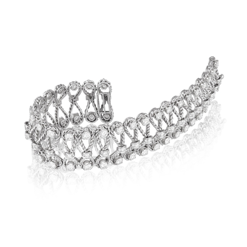 101 - A DIAMOND BRACELET, CIRCA 1960  Of openwork ropetwist design, each loop set with brilliant-cut diamo... 