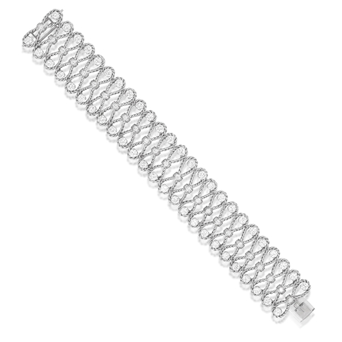 101 - A DIAMOND BRACELET, CIRCA 1960  Of openwork ropetwist design, each loop set with brilliant-cut diamo... 