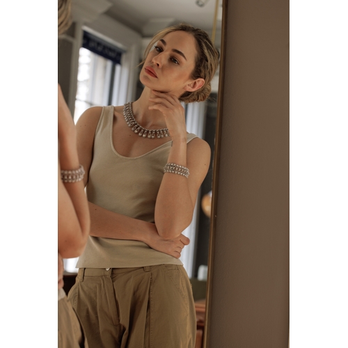 102 - AN IMPORTANT DIAMOND NECKLACE, CIRCA 1960  Of openwork ropetwist design, each loop set with brillian... 