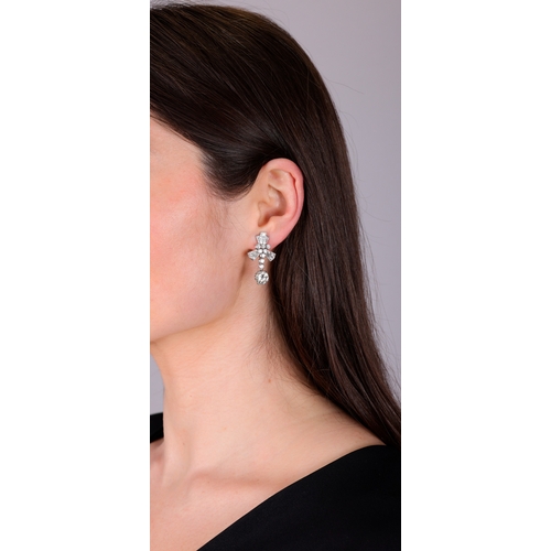 116 - A PAIR OF DIAMOND PENDENT EARRINGS  Each brilliant-cut diamond suspended from a line of brilliant-cu... 