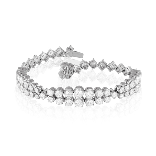 119 - A DIAMOND BRACELET, CIRCA 1965  The flexible strap designed as three double row of graduated brillia... 