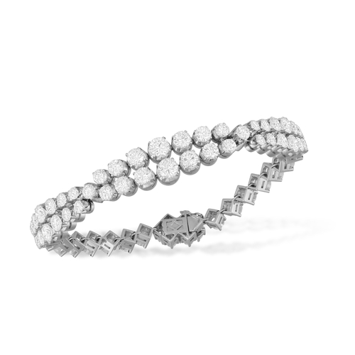 119 - A DIAMOND BRACELET, CIRCA 1965  The flexible strap designed as three double row of graduated brillia... 