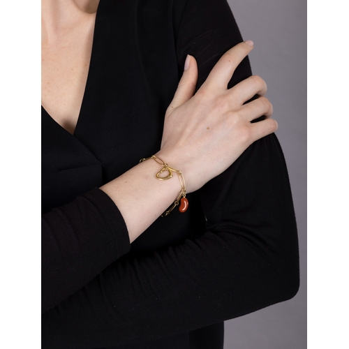 196 - TIFFANY & CO, ELSA PERETTI: A GOLD AND HARDSTONE CHARM BRACELET  The fancy-link chain suspending fou... 
