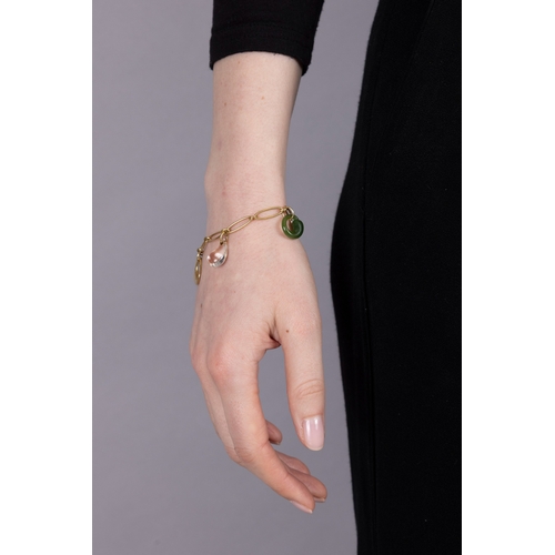 196 - TIFFANY & CO, ELSA PERETTI: A GOLD AND HARDSTONE CHARM BRACELET  The fancy-link chain suspending fou... 