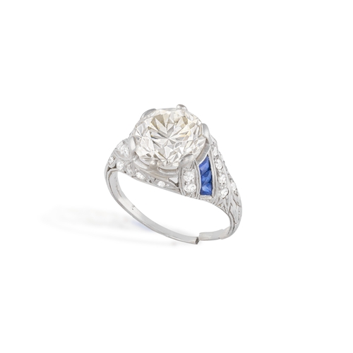 63 - AN ART DECO DIAMOND AND SAPPHIRE RING, CIRCA 1925  Set with an old European-cut diamond weighing app... 