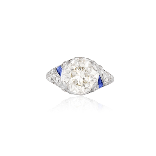 63 - AN ART DECO DIAMOND AND SAPPHIRE RING, CIRCA 1925  Set with an old European-cut diamond weighing app... 