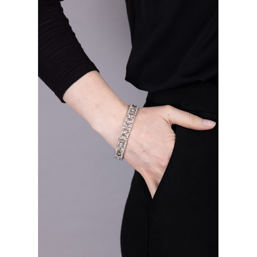 65 - AN ART DECO DIAMOND BRACELET, CIRCA 1930  Of openwork geometric design, set throughout with old Euro... 