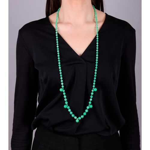 66 - A JADE BEAD SAUTOIR NECKLACE  The single row of graduated jade beads, measuring approximately 9.48mm... 