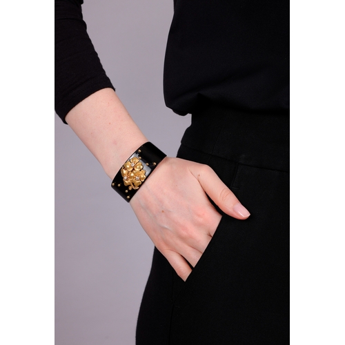 69 - CARTIER: A DIAMOND, LACQUER AND GOLD BANGLE, CIRCA 1910  The private collection of a Continental Lad... 