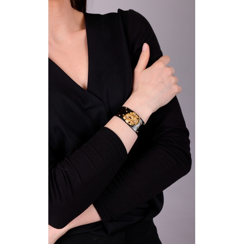 69 - CARTIER: A DIAMOND, LACQUER AND GOLD BANGLE, CIRCA 1910  The private collection of a Continental Lad... 