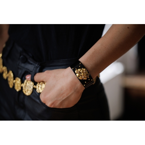 69 - CARTIER: A DIAMOND, LACQUER AND GOLD BANGLE, CIRCA 1910  The private collection of a Continental Lad... 