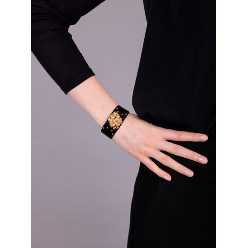 69 - CARTIER: A DIAMOND, LACQUER AND GOLD BANGLE, CIRCA 1910  The private collection of a Continental Lad... 