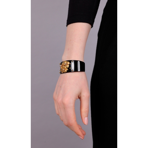 69 - CARTIER: A DIAMOND, LACQUER AND GOLD BANGLE, CIRCA 1910  The private collection of a Continental Lad... 