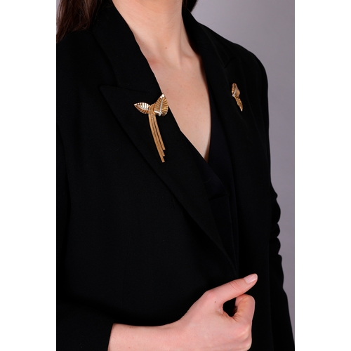 72 - A DIAMOND AND GOLD DOUBLE-CLIP BROOCH, FRENCH, CIRCA 1945-50  Each clip of stylised leaf motif, with... 