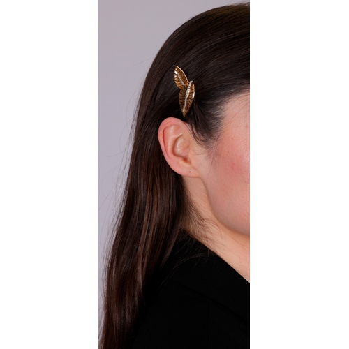72 - A DIAMOND AND GOLD DOUBLE-CLIP BROOCH, FRENCH, CIRCA 1945-50  Each clip of stylised leaf motif, with... 