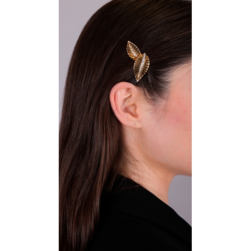 72 - A DIAMOND AND GOLD DOUBLE-CLIP BROOCH, FRENCH, CIRCA 1945-50  Each clip of stylised leaf motif, with... 