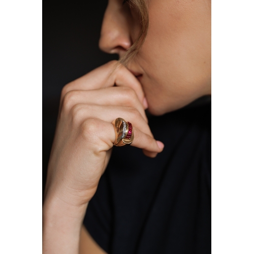 73 - A RETRO RUBY AND DIAMOND TANK RING, FRENCH, CIRCA 1945  The bombé mount designed as two overlapping ... 