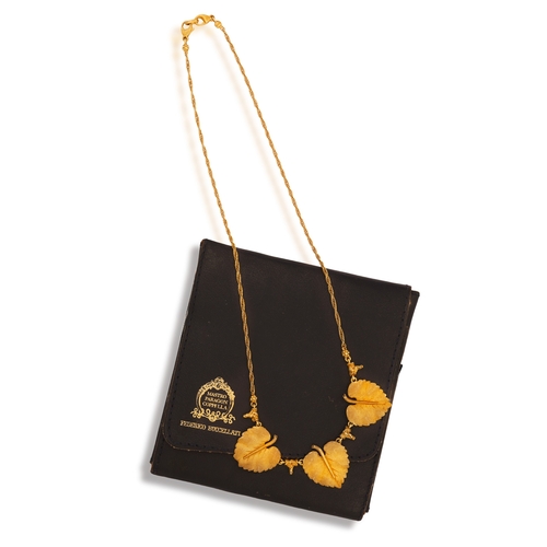 77 - FEDERICO BUCCELLATI: A GOLD NECKLACE  Composed of three textured gold leaves, each with a raised cen... 