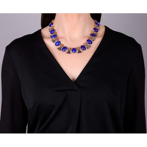 80 - BUCCELLATI: A LAPIS LAZULI NECKLACE, CIRCA 1960  Composed of eighteen slightly graduated oval-shaped... 