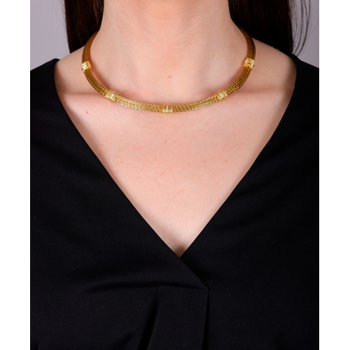 81 - ILIAS LALAOUNIS: A DIAMOND AND GOLD NECKLACE  Composed of a double herringbone rope twist chain, the... 