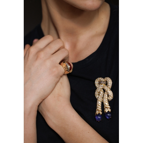 89 - RENÉ BOIVIN, DESIGNED BY JULIETTE MOUTARD: A RARE AND COLLECTIBLE SAPPHIRE AND DIAMOND 'NOEUD DE PAS... 