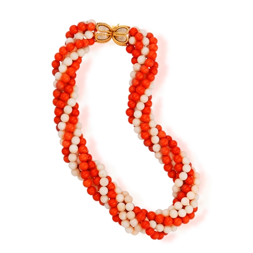 90 - A CORAL AND GOLD NECKLACE, CIRCA 1970  Of torsade design, set with eight strands of red and angel's ... 
