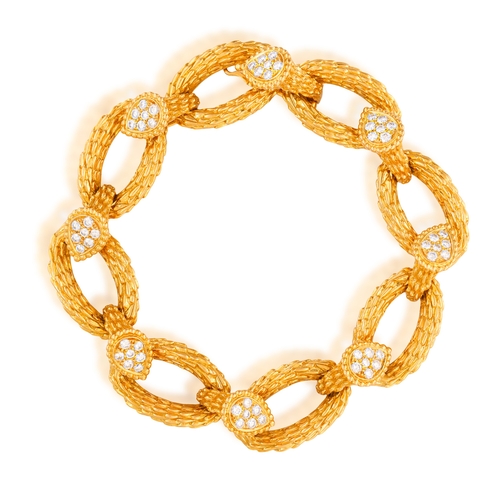 95 - BOUCHERON: A DIAMOND 'SERPENT BOHÈME' BRACELET, CIRCA 1970  Composed of a series of oval-shaped text... 