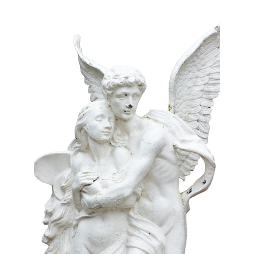 A WHITE PAINTED CAST IRON GARDEN STATUE OF CUPID AND PYSCHE, modelled ...