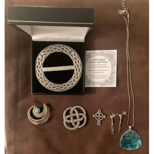 100 - A collection of pewter and white metal jewellery items.