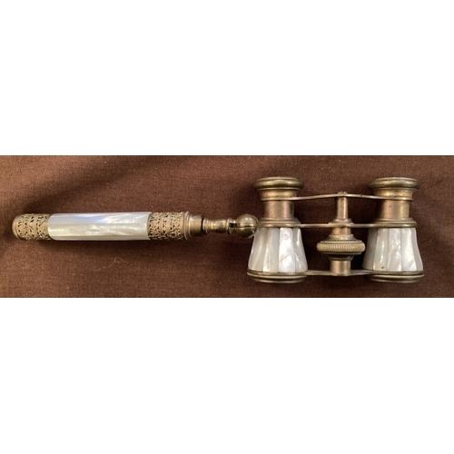 122 - An early pair of yellow metal and mother of pearl opera glasses with detachable hand piece