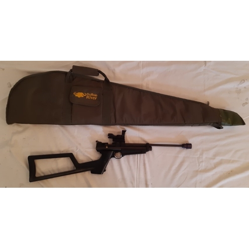 54 - A Stock bolt action, spring loaded air rifle with sights, in a Buffalo River gun case.