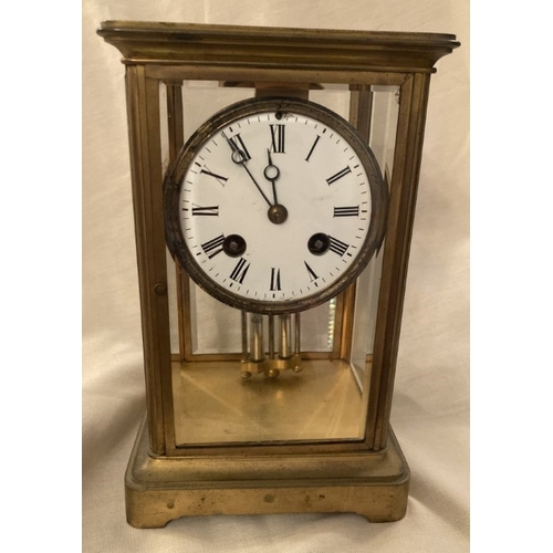 75 - Early brass carriage style mantle clock with mercury pendulum, striking on a bell, bevelled glass pa... 