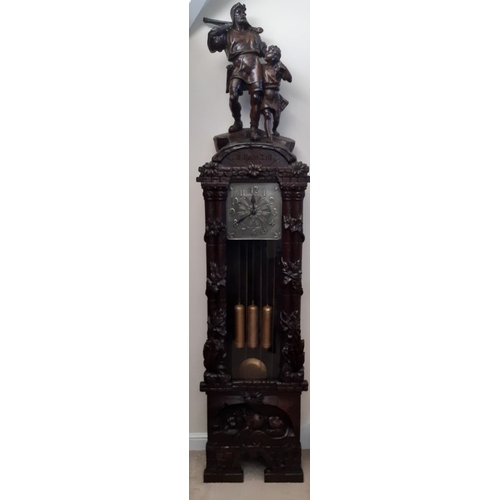 76 - 1920’s Black Forest long cased clock with a somewhat rare carving of William Tell to the top, seated... 