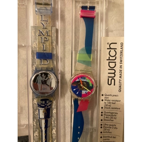 77 - Two as new Swatch watches Olympic Games Atlanta 1996 plus one other pink and green design.