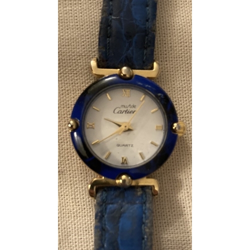 85 - A Must De Cartier ladies' quartz wrist watch with blue enamel surround to dial.