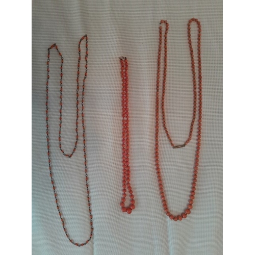 93 - Three coral necklaces, 96cm, 94cm, 46cm, approx.