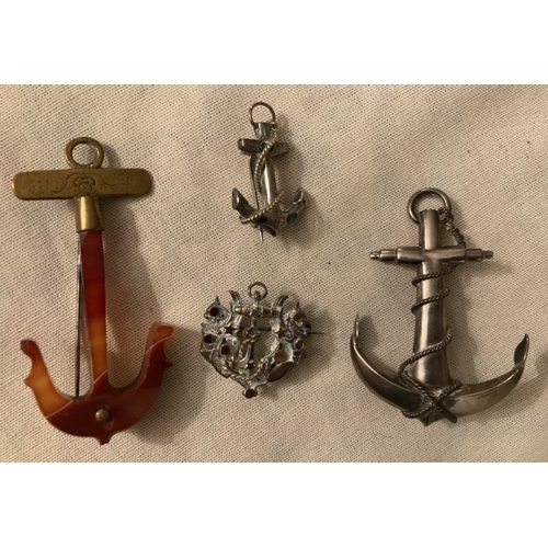 97 - Four various anchor shaped brooches, silver and yellow metal.