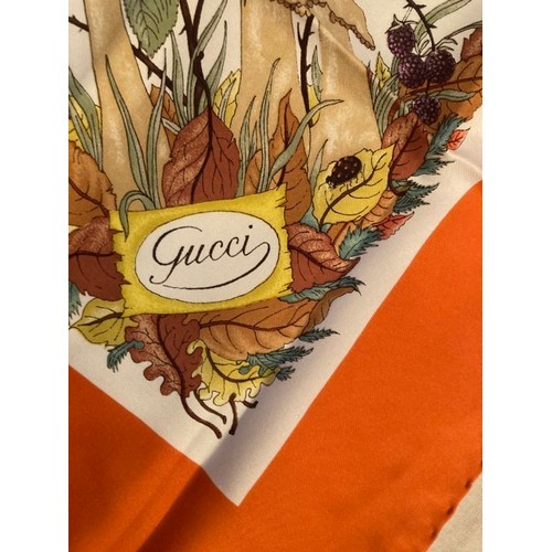 65 - A 1970's Gucci silk scarf, depicting insects, fungi and floribunda in original Hermes pouch and Herm... 