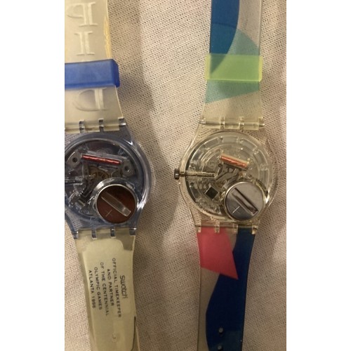 77 - Two as new Swatch watches Olympic Games Atlanta 1996 plus one other pink and green design.